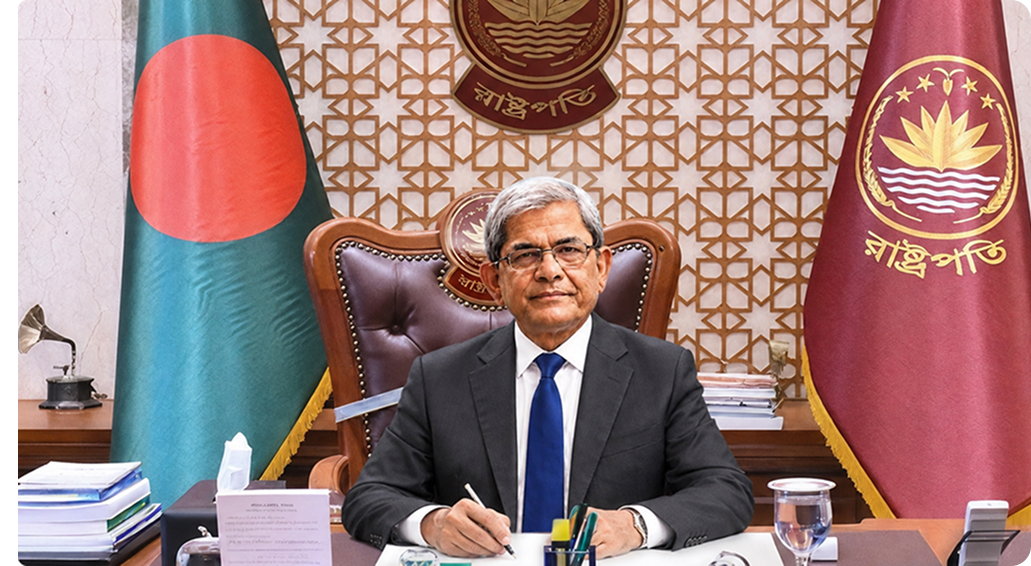 His Excellency Mr. Mirza Fakhrul Islam Alamgir, Chancellor of RTM-AKTU, seated beside the national flag